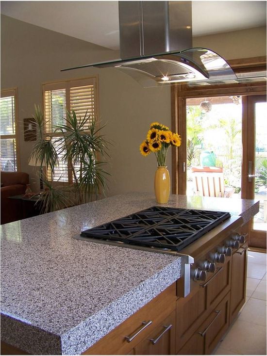 A kitchen with a stove and counter top